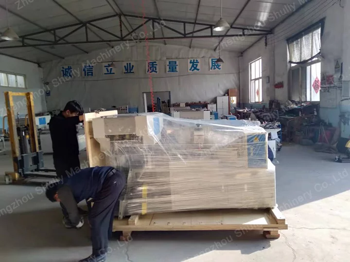Workers laminating the machine